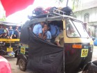 While enjoying a little drink, school across the street was out and the "school" taxi came to pick up the kids...we stopped counting at 12, but a bunch of kids are stuffed in this riksja