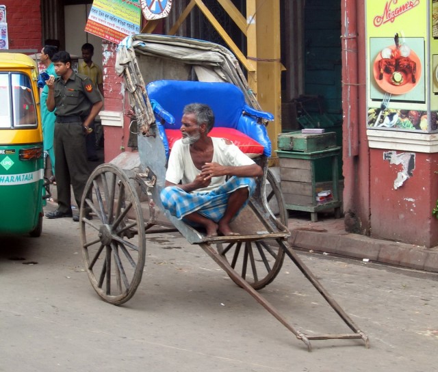 lonesome Indian looking for business, didn't get our business, we walked the whole place, including muddy feet and running like crazy to catch our train