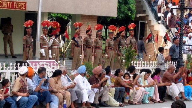 these soldiers marched to the gates, got the national flags down and smashed the gates (that's about it)